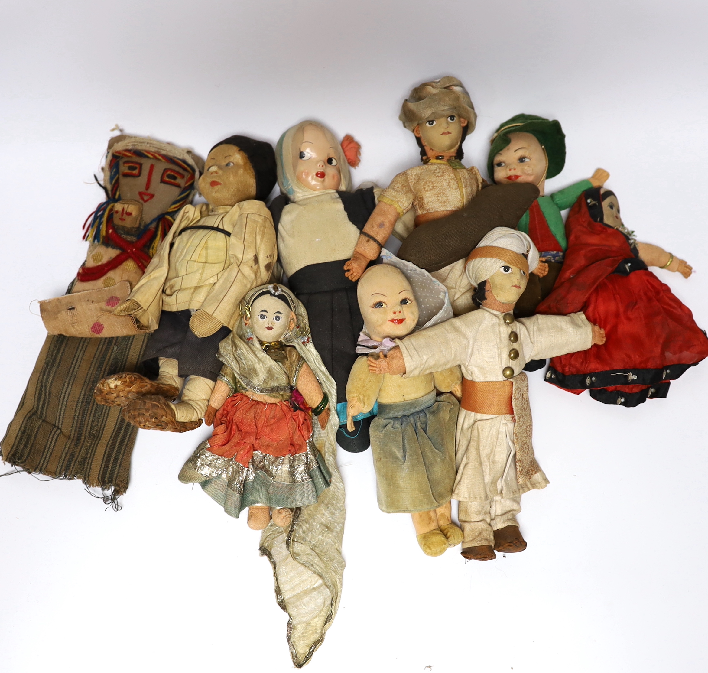 Nine dolls in European and Asian costumes